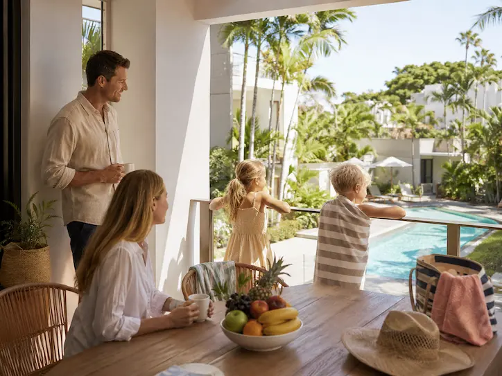Family relaxing at kid-friendly accommodation near Noosa Beach during a holiday.