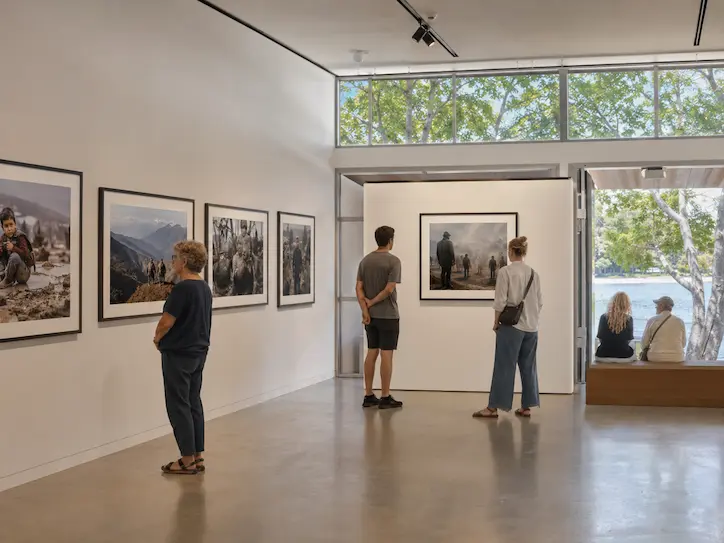 Visitors viewing a photography exhibition inside Noosa Regional Gallery in Tewantin